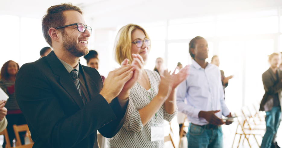 shot of group of business people clapping
