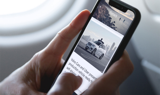 A car displayed on the app screen with another car in the background. Illustrates the Volvo app's car specifications.